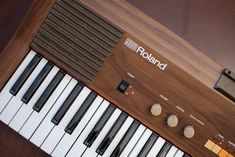 a close up of an electronic keyboard with many knobs